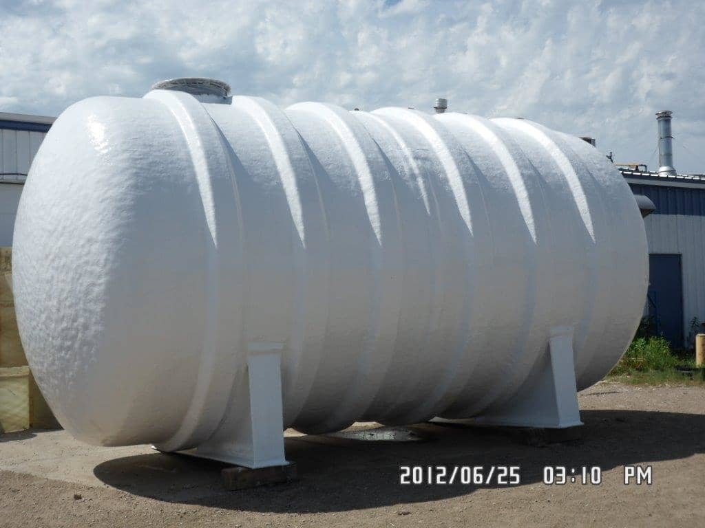 A white fiberglass hot water tank.
